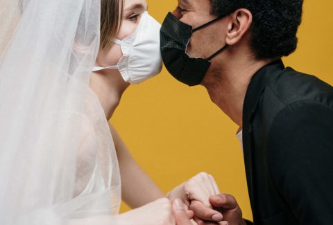 Home 23 man-in-black-suit-jacket-holding-woman-in-white-wedding-3951880